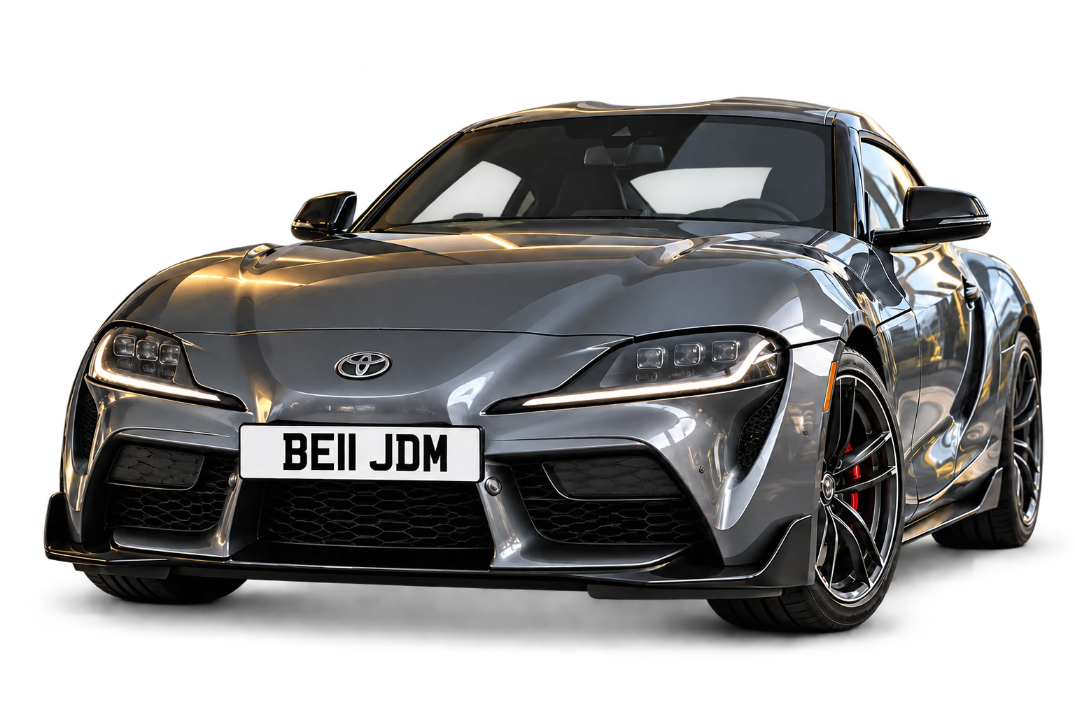 Graphite sports car displaying a BE11 JDM number plate, with a soft ground shadow