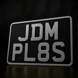 black and silver motorcycle number plates. Vintage motorcycle number plates in pressed metal.