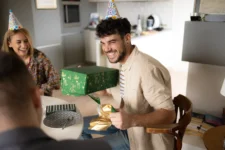 Recipient smiling after receiving a private number plate gift