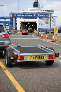 UK trailer displaying separate legal number plate at international ferry terminal | JDM Plates | 3rd February 2026 UK trailer displaying separate legal number plate at international ferry terminal
