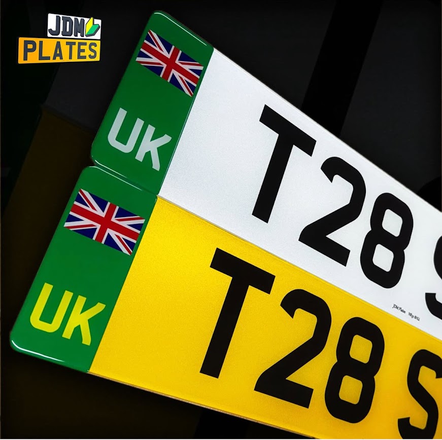 UK number plates with green EV identifier and Union Jack, white front and yellow rear by JDM Plates.
